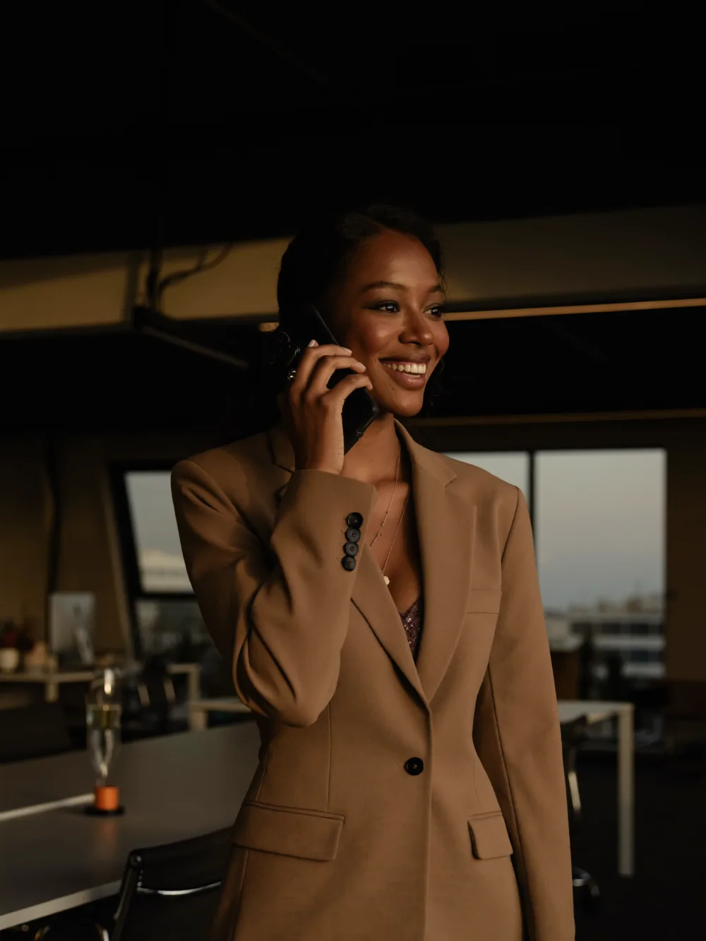 Smiling team member on a phone call
